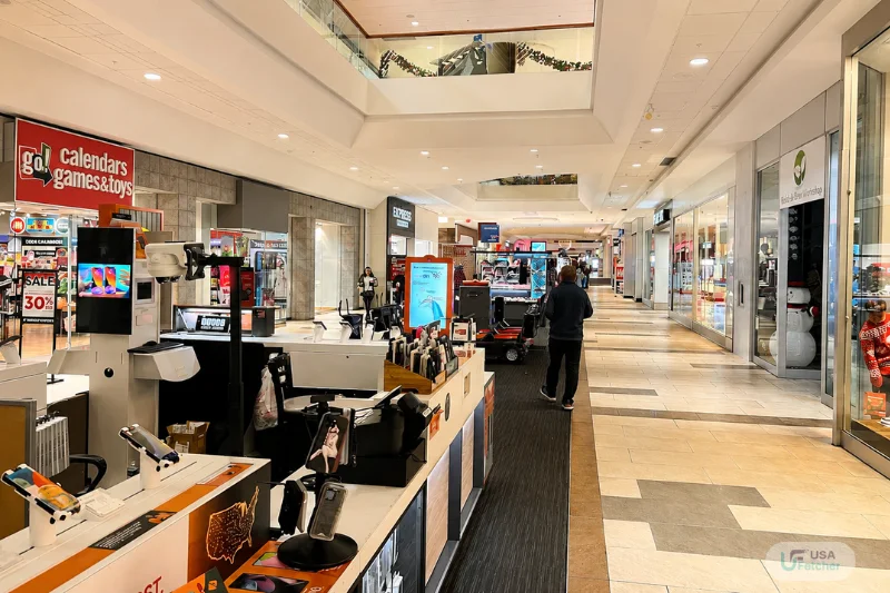 Spacious shopping corridor inside Oak Park Mall with retail stores and kiosks