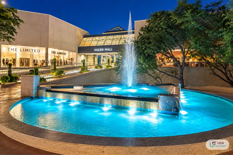 Illuminated fountain outside Hulen Mall in Fort Worth at night
