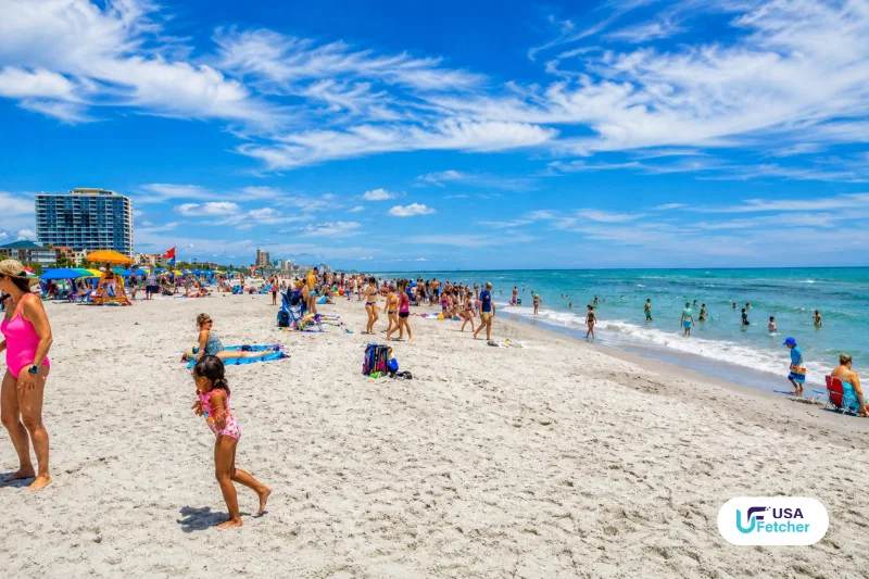 Visitors enjoying a busy day along the sandy shoreline at Myrtle Beach