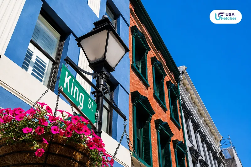 King Street Charleston street sign with historic buildings and colorful downtown architecture